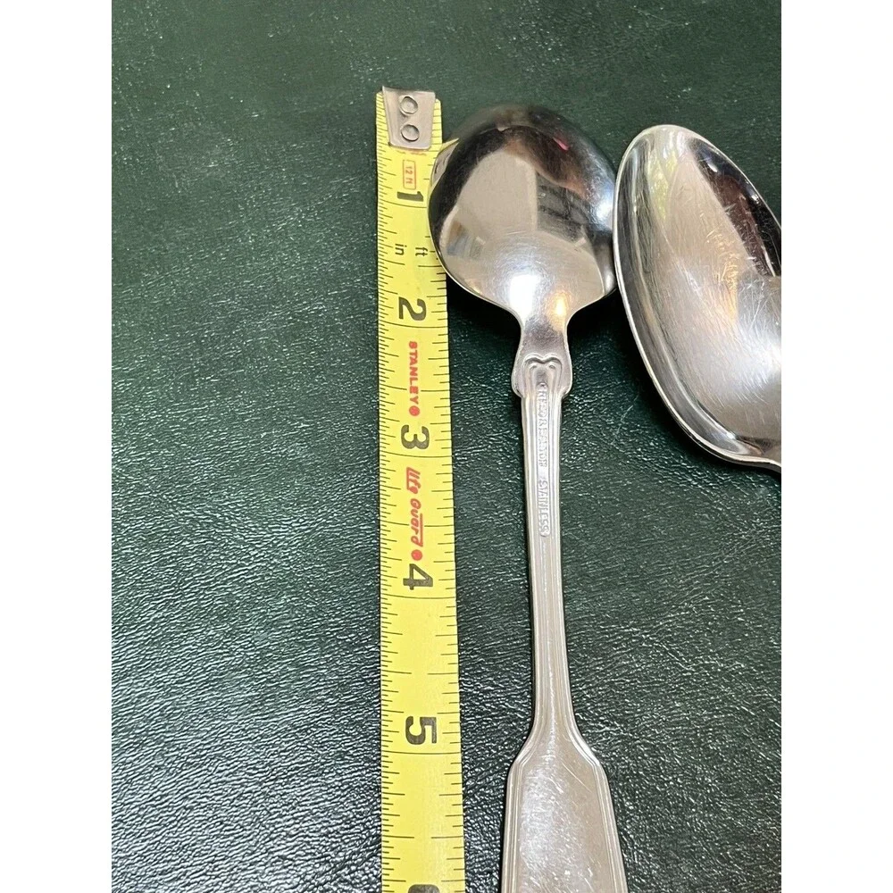 Reed & Barton Colonial Shell stainless-steel oval soup/place spoons.